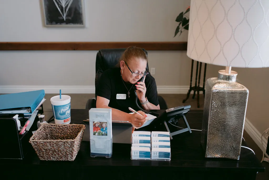 Heritage Assisted Living caregiver providing personalized support to a resident
