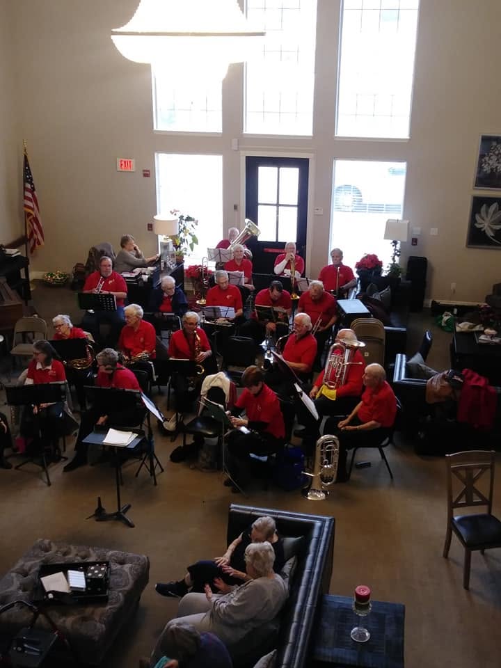 Christmas celebration at Heritage with residents receiving gifts